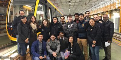 MIT Global Scale Network Students at work site with light rail